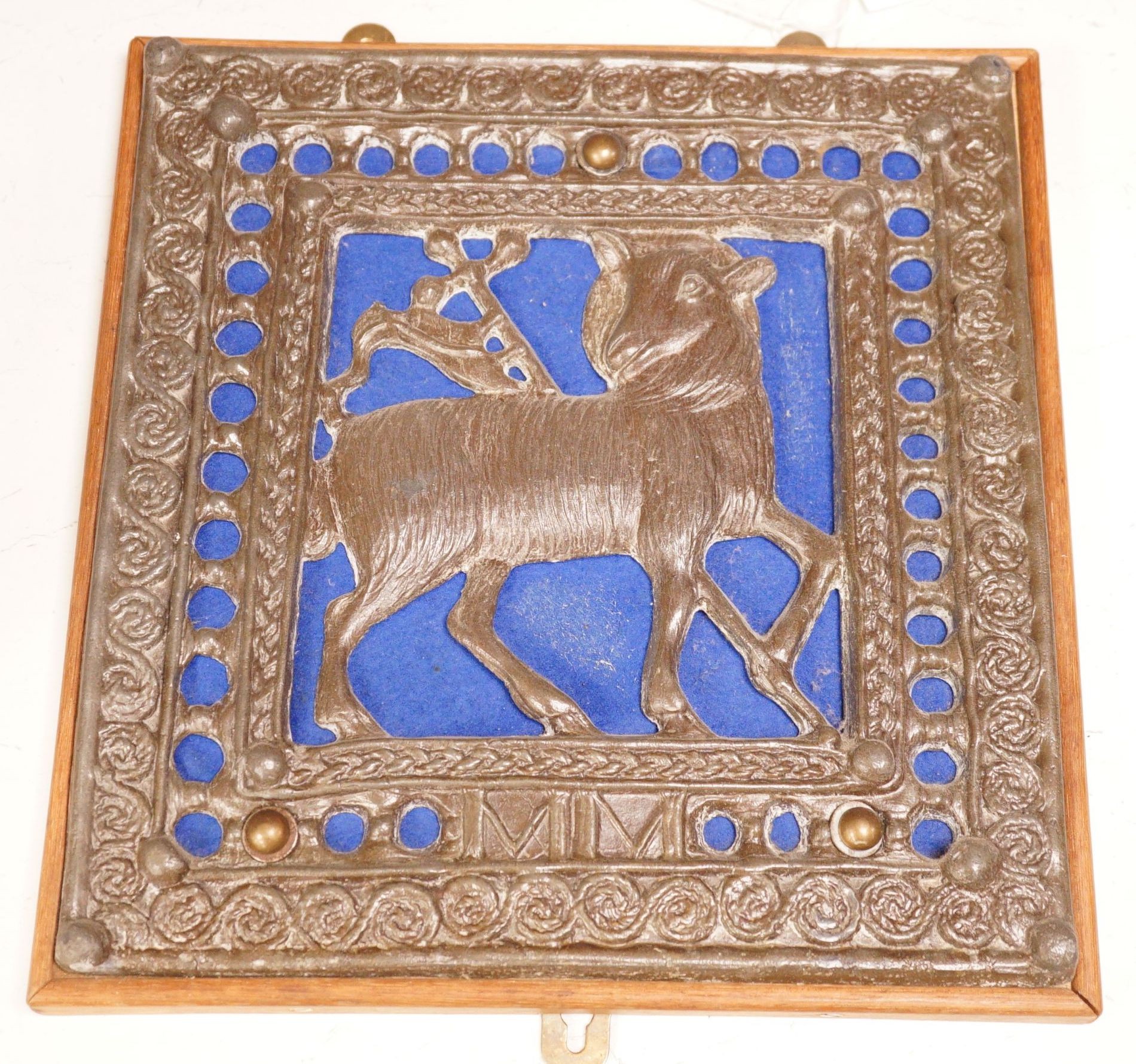 A wall mounted Lamb of God cast metal panel, 31 x 29cm
